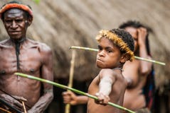 Children Dani tribe learning to throw a spear.